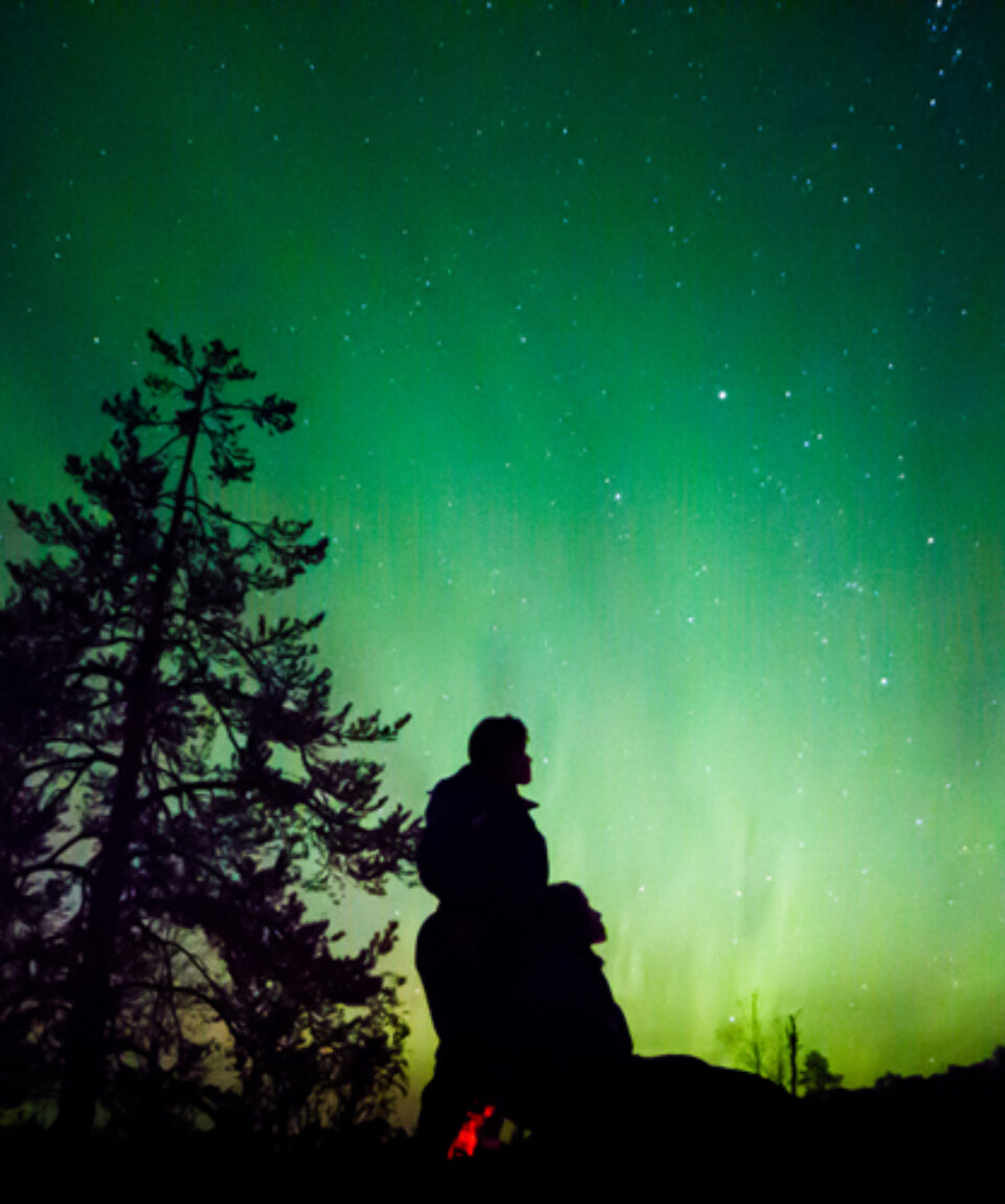 Northern Lights by Minivan in Levi